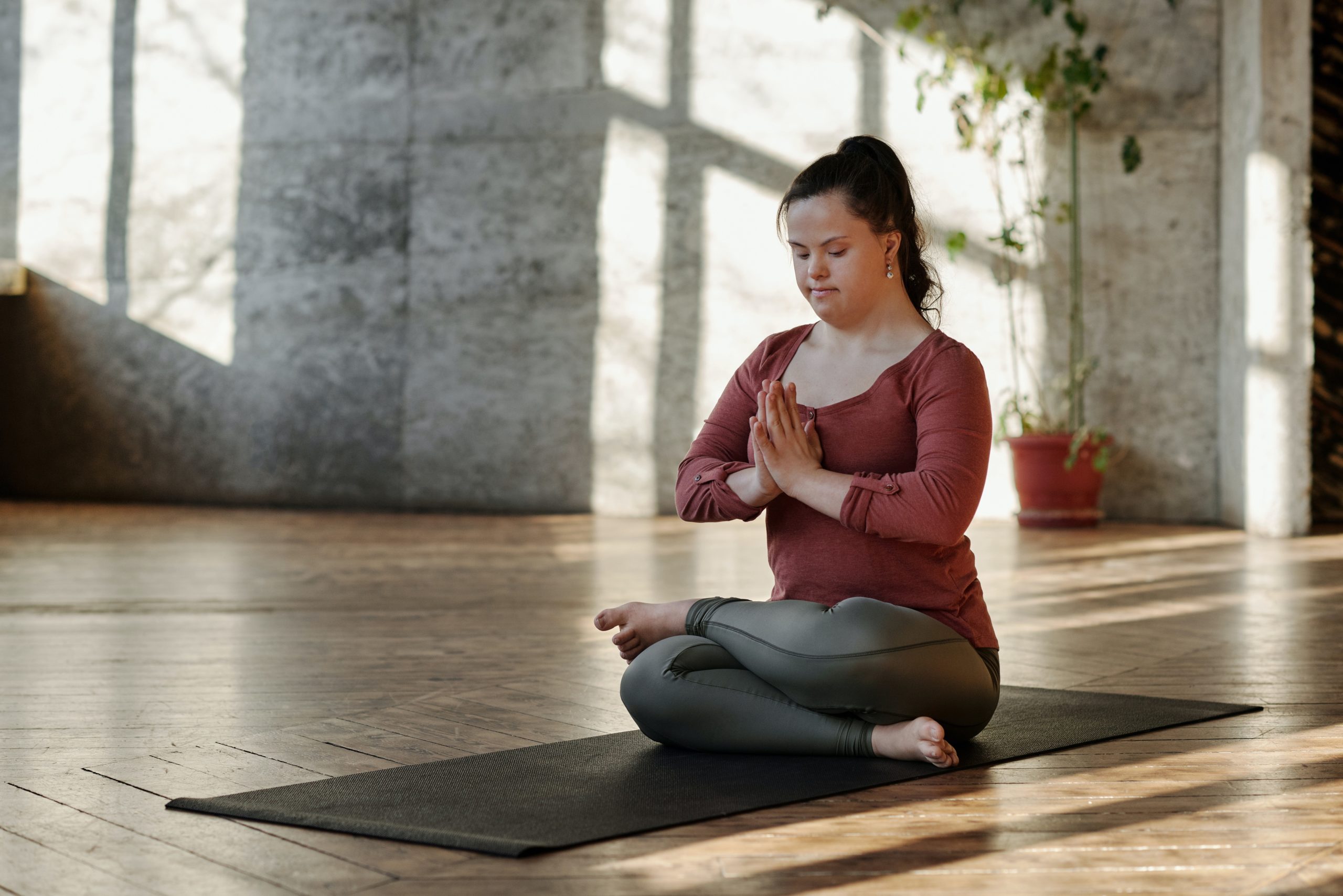 Woman practicing yoga in a yoga studio