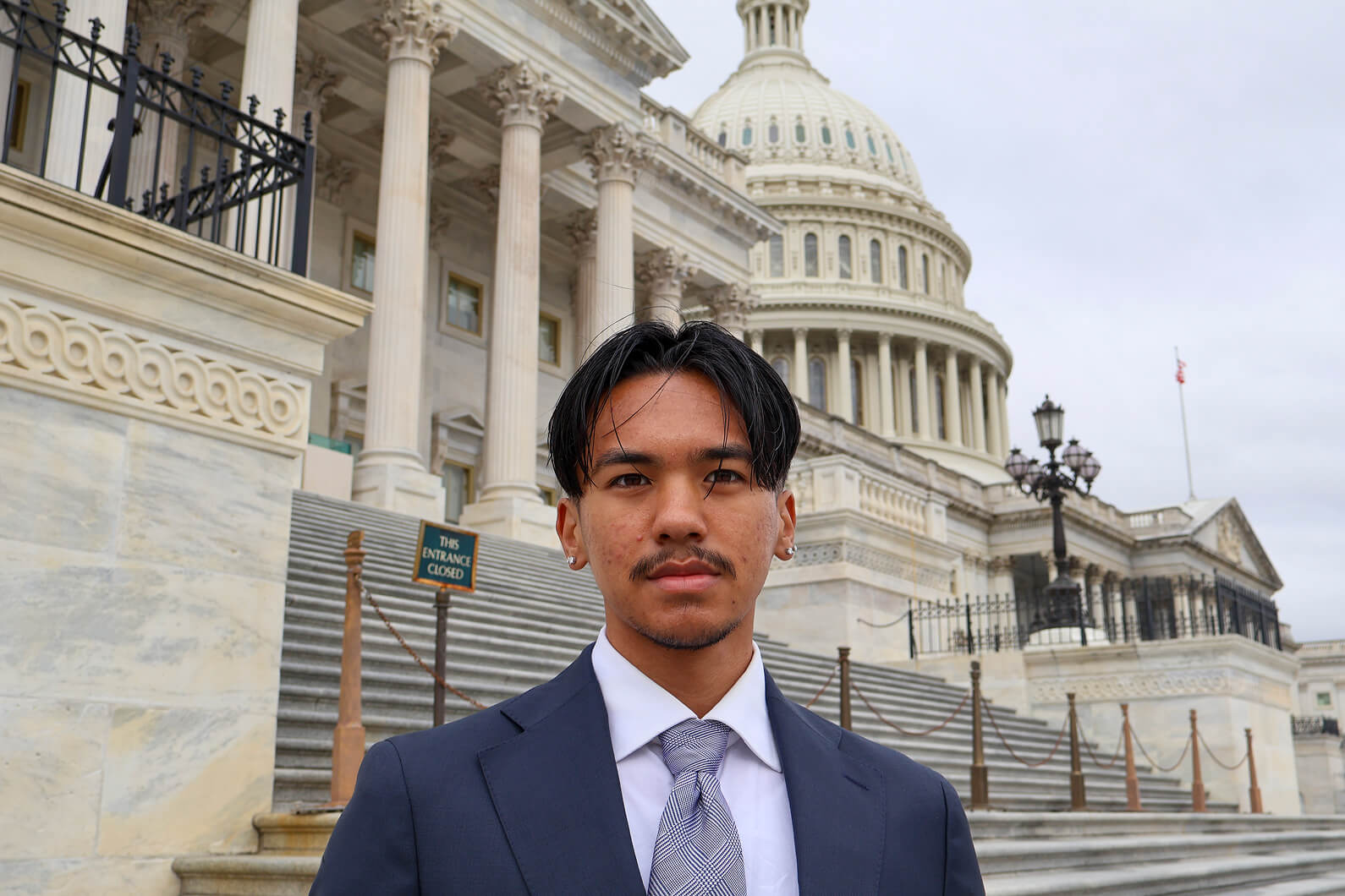 Juan Garcia standing in front of capital building