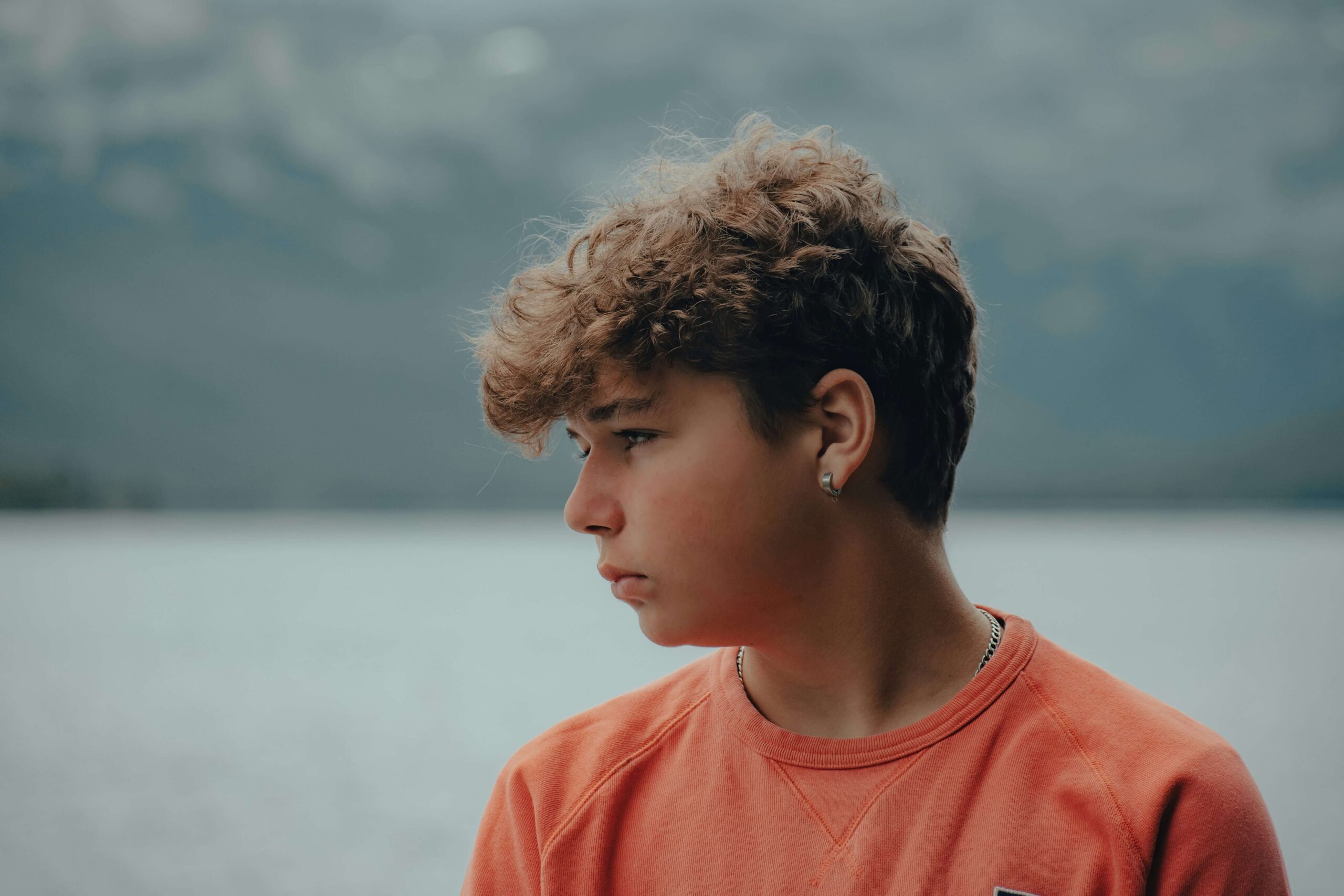 Teen boy looks to the side