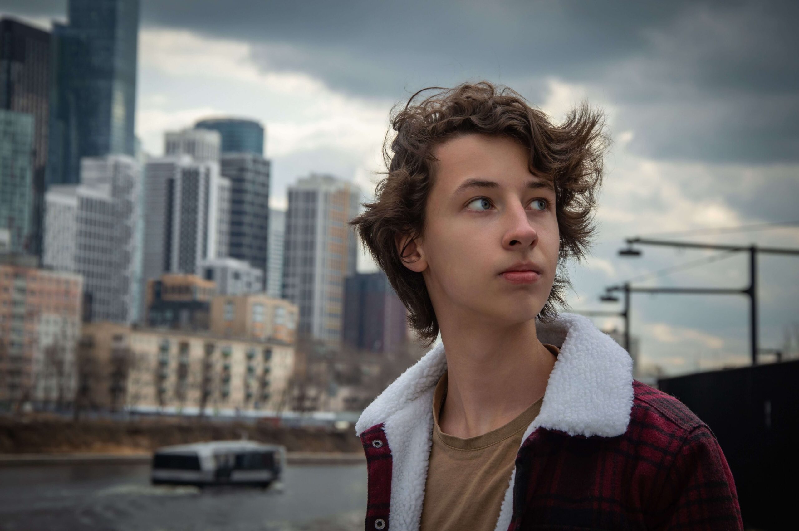 A teen boy looks stressed
